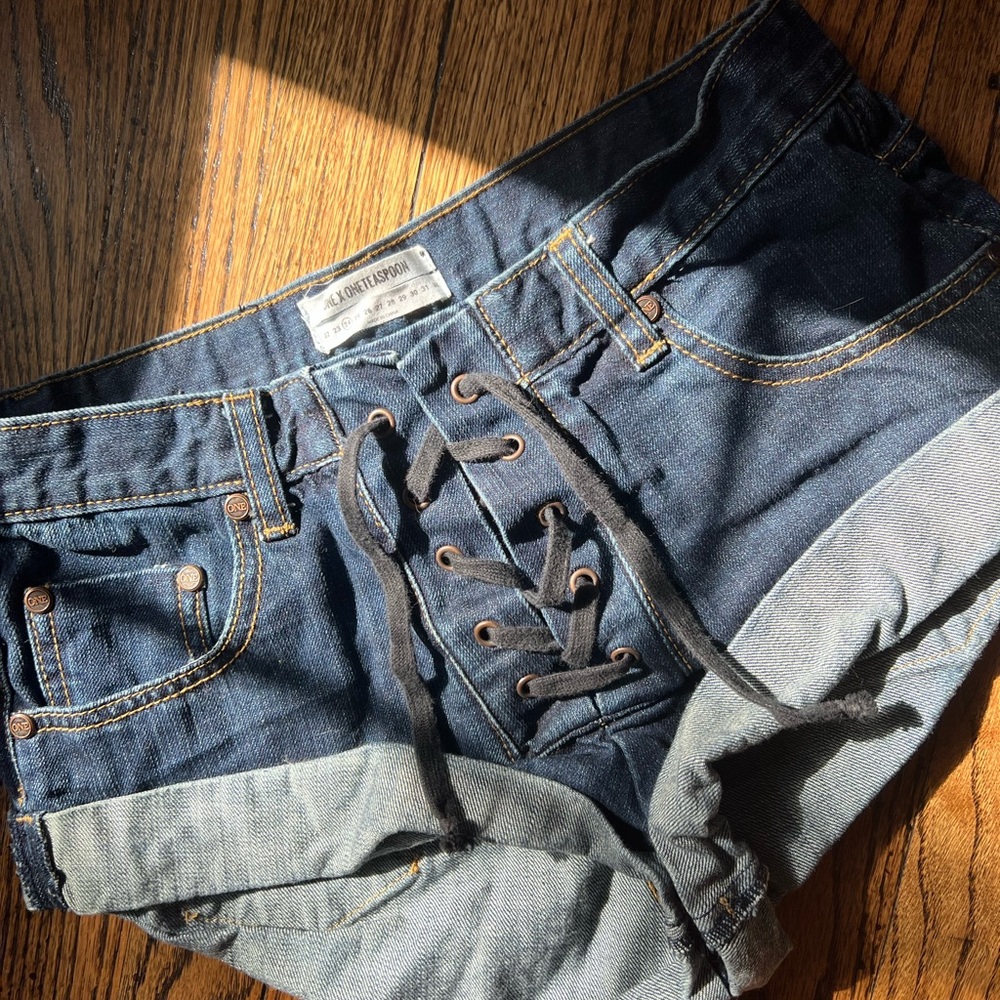 Size 24 lightly worn one teaspoon lace up denim shorts